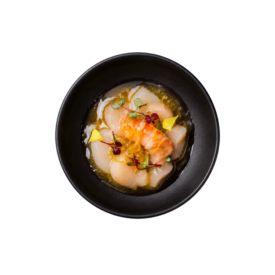 Japanese izakaya plate with scallop and prawn in a black ceramic bowl at Yuzu Sushi and Bar, Reno Nevada
