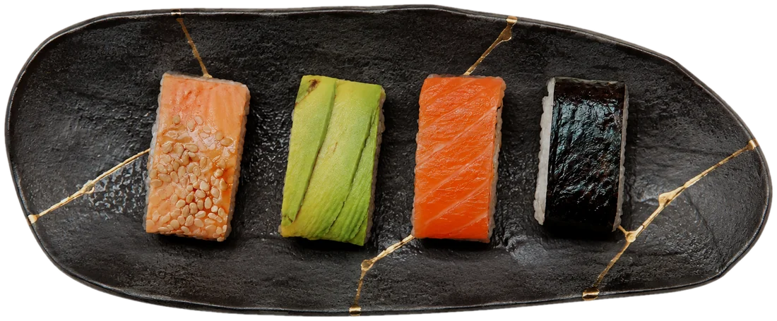 Sushi rolls — salmon crumble, avocado and nori maki — on a kintsugi plate at Yuzu Sushi and Bar, Reno Nevada